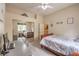 Cozy bedroom with mirrored closet doors, carpet floors, and a view of the outdoors at 7730 Brambly Creek Ct, Las Vegas, NV 89129
