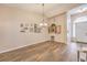 A well-lit dining room showcases hardwood floors, decorative accents, and an open layout ideal for hosting gatherings at 7730 Brambly Creek Ct, Las Vegas, NV 89129