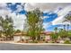 Charming single-story home with a well-maintained lawn and a two car garage at 7730 Brambly Creek Ct, Las Vegas, NV 89129