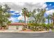 Charming single-story home featuring a two-car garage, tile roof, and desert-friendly landscaping for modern curb appeal at 7730 Brambly Creek Ct, Las Vegas, NV 89129