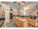 Spacious kitchen featuring an island, stainless appliances, wood cabinetry, and double ovens at 7730 Brambly Creek Ct, Las Vegas, NV 89129