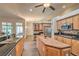 Bright kitchen with a center island, stainless steel appliances, and abundant cabinet space at 7730 Brambly Creek Ct, Las Vegas, NV 89129