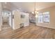 A spacious living room boasts hardwood floors, neutral tones and ample lighting to create a warm, inviting ambiance at 7730 Brambly Creek Ct, Las Vegas, NV 89129