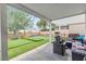 Relaxing backyard with covered patio, putting green and lounge seating provides outdoor comfort at 7929 Ben Hogan Dr, Las Vegas, NV 89149