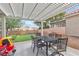 Inviting backyard with covered patio, a putting green, and space for outdoor activities at 7929 Ben Hogan Dr, Las Vegas, NV 89149