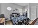 Cozy bedroom with stylish bedding, natural light, and a calming color palette at 7929 Ben Hogan Dr, Las Vegas, NV 89149