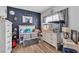 Bright bedroom with dark blue accent wall, toys, and decorative art at 7929 Ben Hogan Dr, Las Vegas, NV 89149