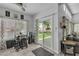 Bright breakfast nook with backyard views, tile floor, and modern decor at 7929 Ben Hogan Dr, Las Vegas, NV 89149