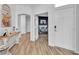 Welcoming entryway with hardwood floors, white trim and doors, and an open-concept design at 7929 Ben Hogan Dr, Las Vegas, NV 89149
