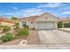 Charming single-story home with a two-car garage and desert landscaping at 7929 Ben Hogan Dr, Las Vegas, NV 89149