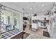 Open-concept kitchen with island, stainless appliances and seamless flow to the living space at 7929 Ben Hogan Dr, Las Vegas, NV 89149