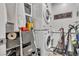 Functional laundry room with stacked washer and dryer, plus ample storage space at 7929 Ben Hogan Dr, Las Vegas, NV 89149