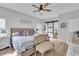 Comfortable main bedroom with hardwood floors, sliding barn door, and neutral color scheme at 7929 Ben Hogan Dr, Las Vegas, NV 89149