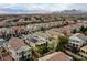 An aerial view of a residential neighborhood featuring desert landscaping, mountain views and diverse home styles at 852 Colina Alta Pl, Las Vegas, NV 89138