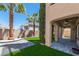 A private backyard featuring desert landscaping, a stone patio and a covered outdoor space at 852 Colina Alta Pl, Las Vegas, NV 89138