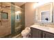 Modern bathroom features a glass shower with rainfall head, vanity with sink, and a toilet at 852 Colina Alta Pl, Las Vegas, NV 89138