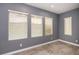 Bright bedroom with three windows offering natural light and tile flooring at 852 Colina Alta Pl, Las Vegas, NV 89138
