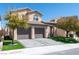 Charming two-story home featuring a tile roof, well-maintained landscaping, and a spacious two-car garage at 852 Colina Alta Pl, Las Vegas, NV 89138