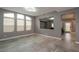 Bright, spacious room with large windows and a pass-through to a living area and a view to the entry hall at 852 Colina Alta Pl, Las Vegas, NV 89138