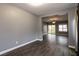 Open living room with hardwood flooring and large windows, bright and airy at 852 Colina Alta Pl, Las Vegas, NV 89138