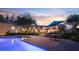 Relaxing pool area with seating and lush landscaping at 8620 W La Madre Way, Las Vegas, NV 89149