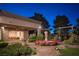 Beautiful backyard with a fountain, greenery, and a covered patio, ideal for outdoor enjoyment at 8620 W La Madre Way, Las Vegas, NV 89149
