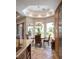 Well-lit dining area with backyard views and chandelier at 8620 W La Madre Way, Las Vegas, NV 89149