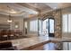 Elegant entryway with stone archway, tile floors, tray ceilings, and decorative iron front doors at 8620 W La Madre Way, Las Vegas, NV 89149