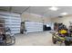 Large garage with two doors and lots of tools, equipment, and storage space at 8620 W La Madre Way, Las Vegas, NV 89149