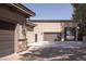 Spacious garage features stone accents, lighting, and room for multiple vehicles plus recreational vehicles at 8620 W La Madre Way, Las Vegas, NV 89149