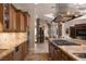 Gourmet kitchen with granite countertops and stainless steel appliances at 8620 W La Madre Way, Las Vegas, NV 89149