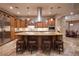 Spacious kitchen features stainless appliances, granite island, and seating at 8620 W La Madre Way, Las Vegas, NV 89149