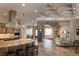 Open-concept living room with stone archway and detailed ceilings at 8620 W La Madre Way, Las Vegas, NV 89149