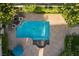 Aerial view of the backyard features a large pool with patios, lush landscaping, and outdoor seating at 8620 W La Madre Way, Las Vegas, NV 89149