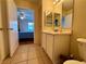 Bathroom with double mirror vanity, tiled flooring and bedroom view at 950 Seven Hills Dr # 2014, Henderson, NV 89052