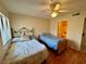 Inviting bedroom featuring two beds, wood floors, ceiling fan and closet at 950 Seven Hills Dr # 2014, Henderson, NV 89052