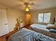 Bright bedroom with two beds, wood floors, ceiling fan, and closet at 950 Seven Hills Dr # 2014, Henderson, NV 89052
