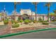 Front view of clubhouse with palms and manicured landscaping at 950 Seven Hills Dr # 2014, Henderson, NV 89052