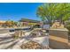 Community picnic area with concrete benches, picnic table, and BBQ grills at 950 Seven Hills Dr # 2014, Henderson, NV 89052