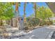 Neighborhood sidewalk lined with desert landscaping, lush trees, and metal fence at 950 Seven Hills Dr # 2014, Henderson, NV 89052