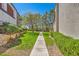 Green space with manicured bushes, stone, sidewalks, trees, and green grass at 950 Seven Hills Dr # 2014, Henderson, NV 89052