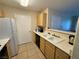Spacious kitchen featuring white countertops, double basin sink, and stainless-steel appliances at 950 Seven Hills Dr # 2014, Henderson, NV 89052
