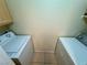 Laundry area with white side-by-side washing machine and dryer at 950 Seven Hills Dr # 2014, Henderson, NV 89052
