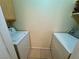 Functional laundry area with tile floor, side-by-side washing machine and dryer at 950 Seven Hills Dr # 2014, Henderson, NV 89052