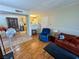 Bright living room featuring laminate floors and open access to dining area and kitchen at 950 Seven Hills Dr # 2014, Henderson, NV 89052