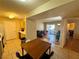 Inviting living room with tile floors, dining area, neutral color palette, and access to a private outdoor balcony at 950 Seven Hills Dr # 2014, Henderson, NV 89052