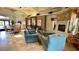 Relaxing lounge area with comfortable seating, a fireplace, and view of the game room at 950 Seven Hills Dr # 2014, Henderson, NV 89052