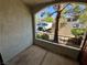 View of the patio featuring black metal railing, with complex and parked vehicle at 950 Seven Hills Dr # 2014, Henderson, NV 89052