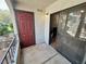 Exterior view of the patio with a sliding glass door and a dark red entry door at 950 Seven Hills Dr # 2014, Henderson, NV 89052