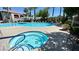 Community pool and jacuzzi with lounge chairs at 950 Seven Hills Dr # 2014, Henderson, NV 89052